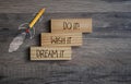 Pencil rocket withg business message Dream it, Wish it, Do it