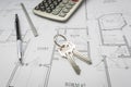 Pencil, Ruler, Calculator and Keys Resting on House Plans Royalty Free Stock Photo