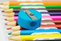 Pencil sharpener on colorful pPencil sharpener on colorful pencils background. School stationeencils background. School stationery Royalty Free Stock Photo