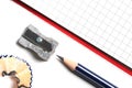 pencil sharpener, pencil and notepad on white desk Royalty Free Stock Photo