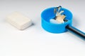 Pencil sharpener shavings and elastic on the white paper. Royalty Free Stock Photo