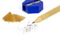 Pencil and sharpener with shavings isolated on white background Royalty Free Stock Photo