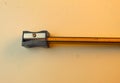Pencil in a sharpener on white desk Royalty Free Stock Photo