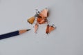 Pencil shaving on white paper Royalty Free Stock Photo