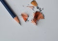 Pencil shaving on white paper Royalty Free Stock Photo