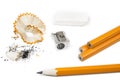 Pencil with pencil shavings and sharpener with eraser.