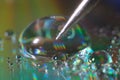 Pencil slate touches the surface of a drop of water close-up Royalty Free Stock Photo