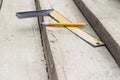 Pencil and a square line on the rafters. Construction of wooden houses and roofs Royalty Free Stock Photo