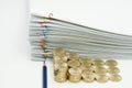 Pencil and step pile of gold coins Royalty Free Stock Photo