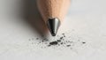 The pencil tip is graphite with nearby specks of graphite debris Royalty Free Stock Photo