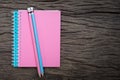 Pencil on top of book mockup on the old wood desk at the background, Flat lay Royalty Free Stock Photo