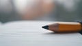 A pencil on top of a piece of paper with blurred background, AI