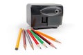 Pencils against of desk electric pencil sharpener in selective focus Royalty Free Stock Photo