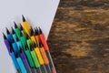 Pencils and drawing pad on wooden background. School stationery Royalty Free Stock Photo