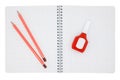 Pencils and error corrector on a school notebook in a cage isolated on a white background Royalty Free Stock Photo