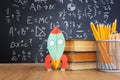 Pencils infront of blackboard with formulas. education concept Royalty Free Stock Photo