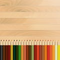 Pencils multicolored autumnal, wooden background