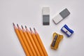 Pencils, pencil sharpener, eraser on a white background Royalty Free Stock Photo