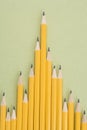 Pencils in uneven row.