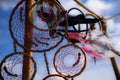 Pendant of the dream catcher on the nature against a background of blue summer sky Royalty Free Stock Photo