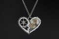 Pendant heart in steampunk style on black