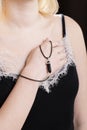 pendant made of natural stone on a woman's hand Royalty Free Stock Photo