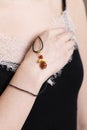 pendant made of natural stone on a woman's hand Royalty Free Stock Photo