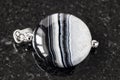 Pendant from striped Agate gemstone on black