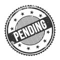 PENDING text written on black grungy round stamp