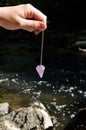 Pendulum dowser with amethyst Royalty Free Stock Photo
