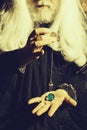 Pendulum in hands of wizard Royalty Free Stock Photo