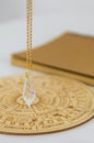 Pendulum numerologist astrologer and zodiac signs. Selective focus. Royalty Free Stock Photo