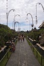 Tourists stroll in groups at Penglipuran Traditional Village in Bali Indonesia Royalty Free Stock Photo