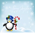 Penguin with Christmas striped comfit Royalty Free Stock Photo