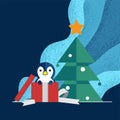 Penguin come up from presents box in front of Christmas tree with blue tone background Royalty Free Stock Photo