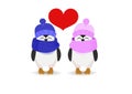 Penguin couple in hats and heart on a light background Royalty Free Stock Photo