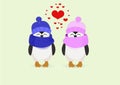 Penguin couple in hats and heart on a yellow background Royalty Free Stock Photo