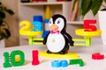 The penguin scale weighs the numbers, the math for the kids.