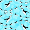 Penguin seamless pattern. Blue background. Penguins diving