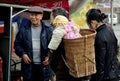 Pengzhou, China: Baby in Wicker Basket Royalty Free Stock Photo