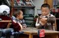 Pengzhou, China: Boy Playing Cards Royalty Free Stock Photo