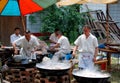 Pengzhou, China: Chefs with Woks