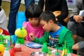 Pengzhou,China: Children Painting Figurine