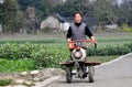 Pengzhou, China: Farmer with Motorised Tiller