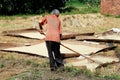 Pengzhou, China: Farmer Raking Rice Grains