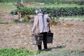 Pengzhou, China: Farmer with Water Buckets Royalty Free Stock Photo