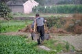 Pengzhou, China: Farmer with Water Buckets Royalty Free Stock Photo