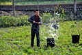 Pengzhou, China: Farmer Watering Plants Royalty Free Stock Photo