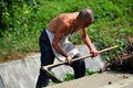 Pengzhou, China: Farmer with Work Hoe