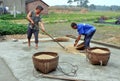 Pengzhou, China: Farmers with Rice Grains Royalty Free Stock Photo